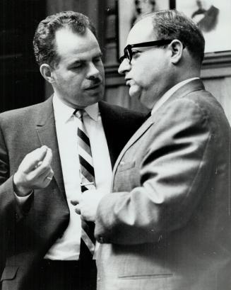 Rey Bremner (left) Commissioner of Public Works talks with Mayor Givens