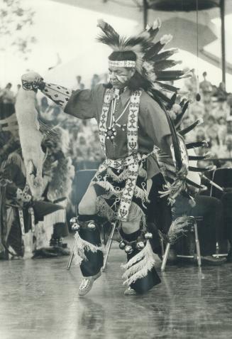 Dances of their forefathers, Grasping a hare in his left hand, a member of the International Prairie Dancers does the traditional belt dance on the la(...)