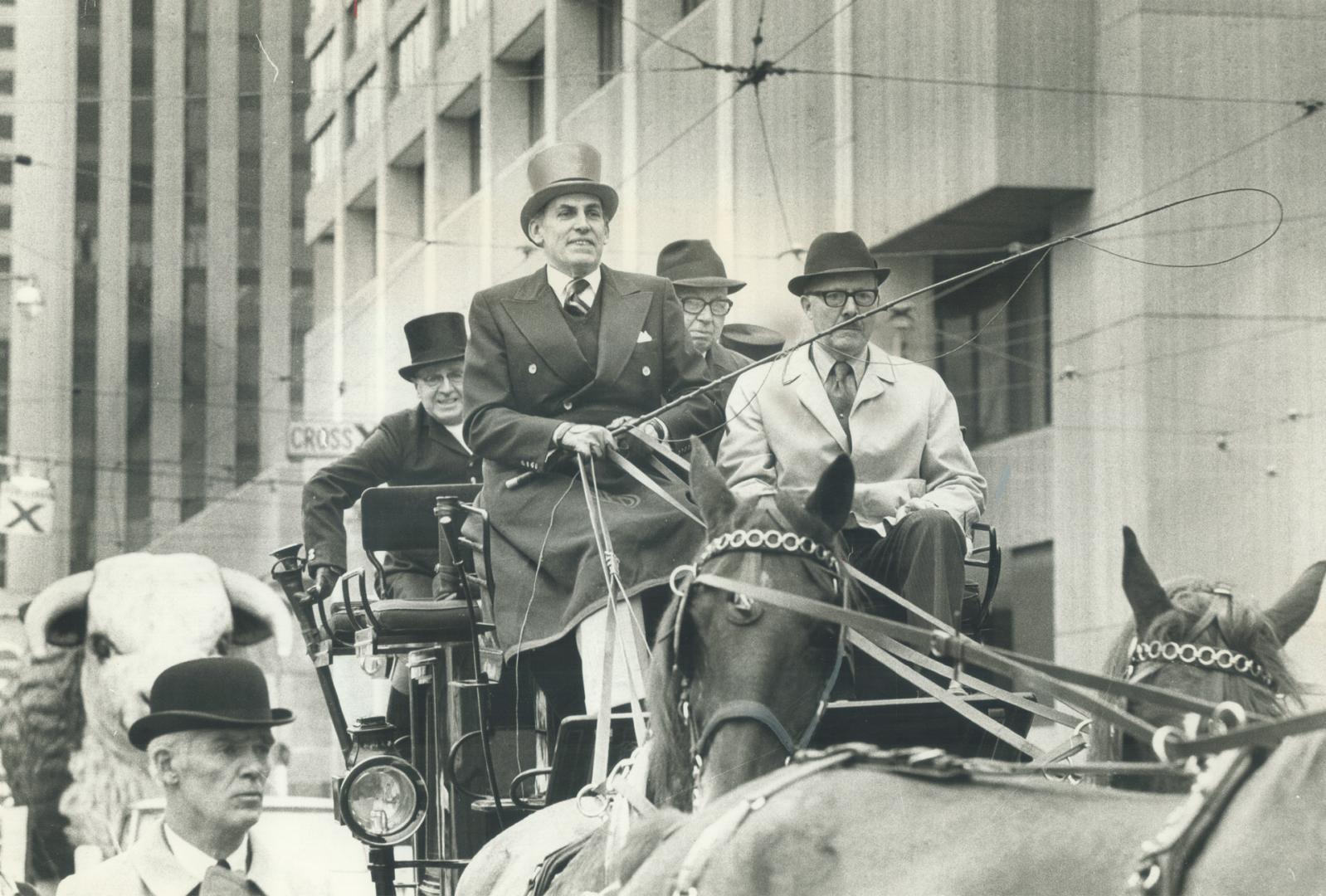 Mayor joins winter fair parade, Mayor William Dennison today took part in parade when he joined Royal Winter Fair officials aboard a four-horse-drawn coach