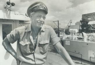 The Captain of the ferry Maple City, which shuttles back and forth between Bathurst St