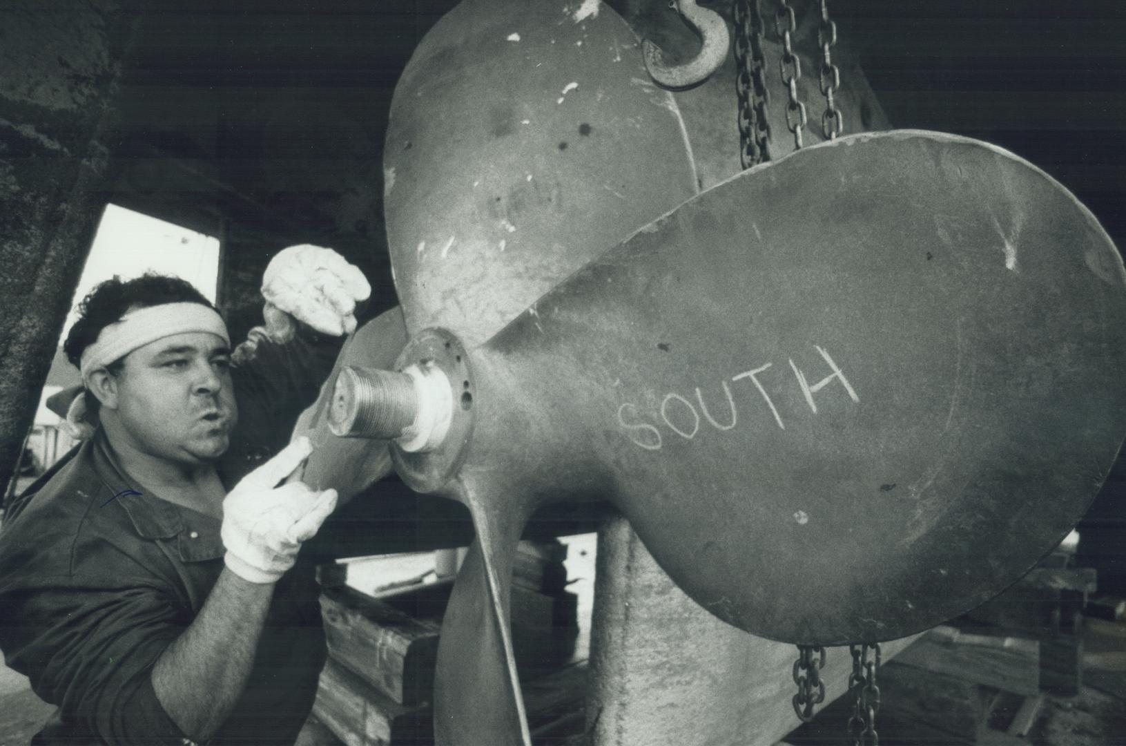 The filing's always done last, Toronto Harbour commission worker Carlos Camelo files the finishing touches on the 142-centimetre (56-inch) propeller of the William Lyon Mackenzie