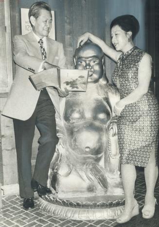 Smiling Buddha stands at the entrance of the China Jade restaurant in the Colonnade, Bloor St