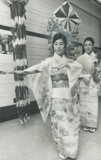 Ancient folk tale retold- Kathy Fujimoto, 13, of Scarborough, and Susie Oyagi, 16, of North York, are rehearsing their dancing and singing for Tanabat(...)