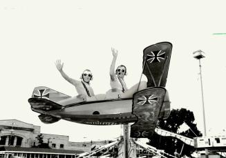 Flying low -- for now, George Kirbyson, 41, left and Rod Ellis, 41, were out for a test ride on the Red Baron at the CNE yesterday, but this ride is a(...)