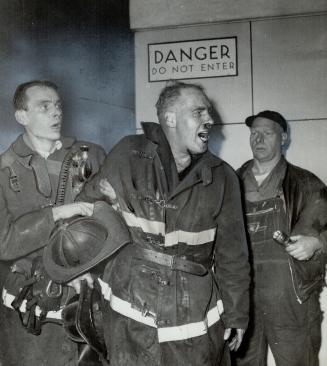 Subway worker helped fireman Jim Lord (Centre) into air