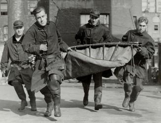 Baptism of fire was given new members of Toronto's fire department when they squelched a roaring ghost blaze in the Adelaide Street hall. Four rookies(...)