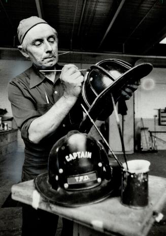 Bob's golden touch: For 13 years former fireman Bob Kendall has been putting the special artistic touches on the Toronto Fire Department's trucks, uniforms, tools and helmets