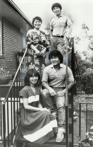 Outside their home in Scarborough are violin-maker Masatoshi Inokuchi, wife Shoko, daughter Mika, 20, and son Miki, 22