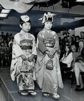 Fashions for young, April Nakamura, 5, and Jane Nakamura, 7, model colorful Japanese fashions at fashion and flower show held yesterday at Japanese Cultural Centre, Wynford Dr