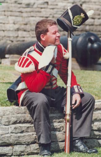 Old sweat: Private Tracy MacDonnell, taking a breather form guiding busloads of excited uniforms are the real cause of the heat of battle