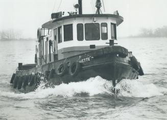 Image shows a tugboat on the lake.