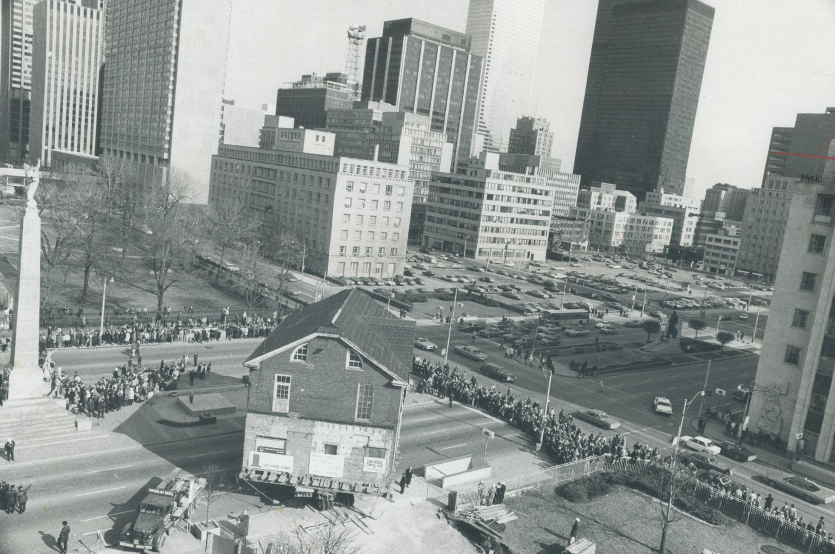 A 200-ton house nears the end of its journey through downtown Toronto as a truck eases it toward a new site near the Canada Life Building at Universit(...)