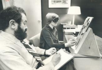 A blindfolded volunteer tries to fit blocks into matching squares in tests at the Clarke Institute of Psychiartry on College St. as Jerome Pauker, the(...)