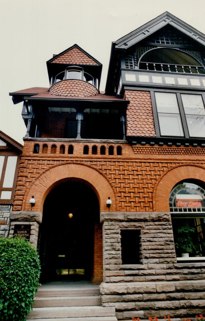 A house at 37 Madison Ave., with Credit River sandstone and Don Valley brick, is an example of Roman Revival style