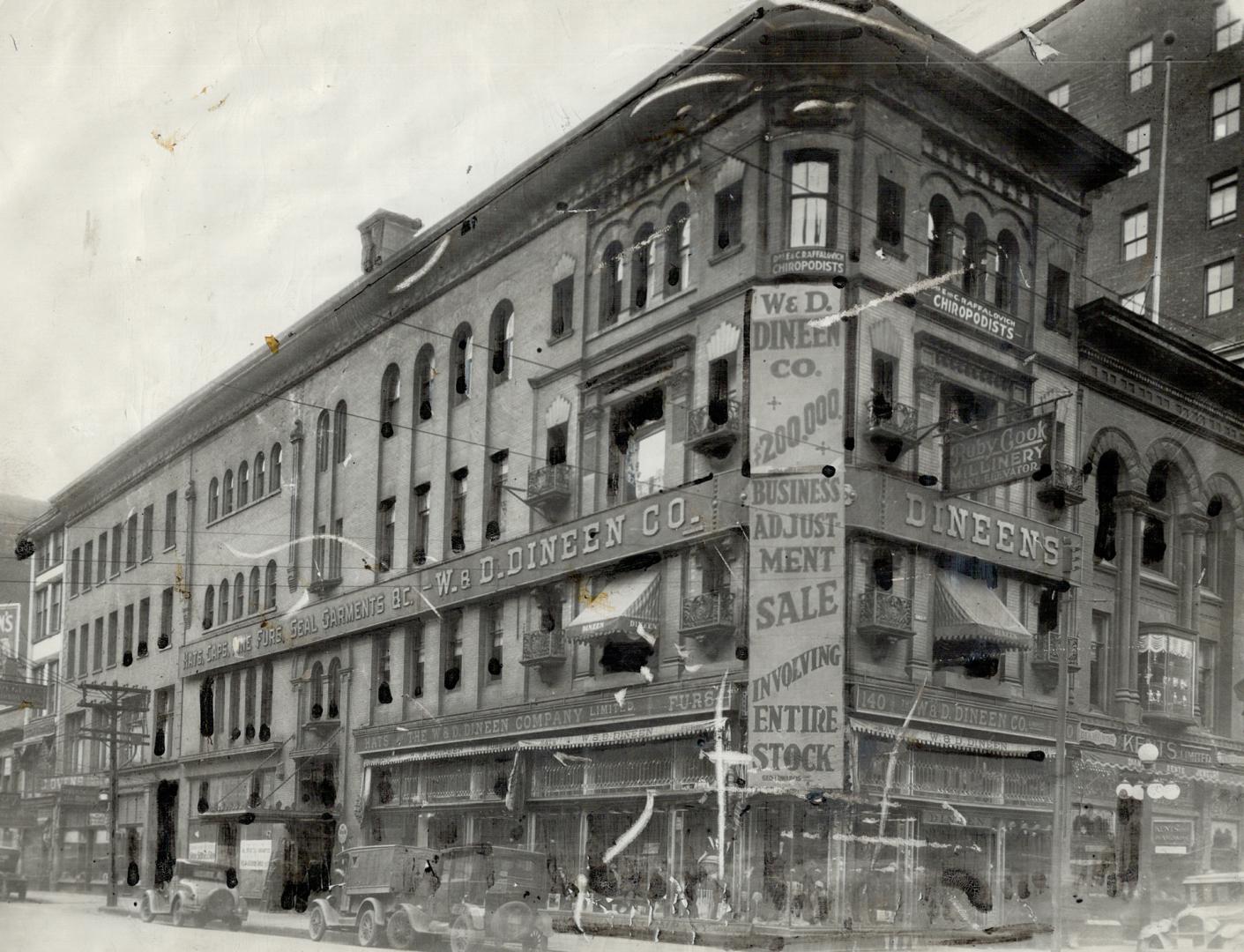 Corner view of four-storey brick building with sign on corner of façade reading, W. &amp; D. Di…