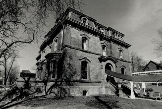 George Brown House (circa 1875) is a typical Second Empire building with a mansard roof and dormer windows