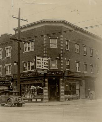 Corner shop with signs above windows reading, Great Atlantic &amp; Pacific Tea Company Limited.