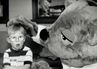 Friendly Reassurance. Dental Health Month representative Barkley Beaver gives 3-year-old Braeden MacDonald a gentle pat during a visit to the Hospital(...)