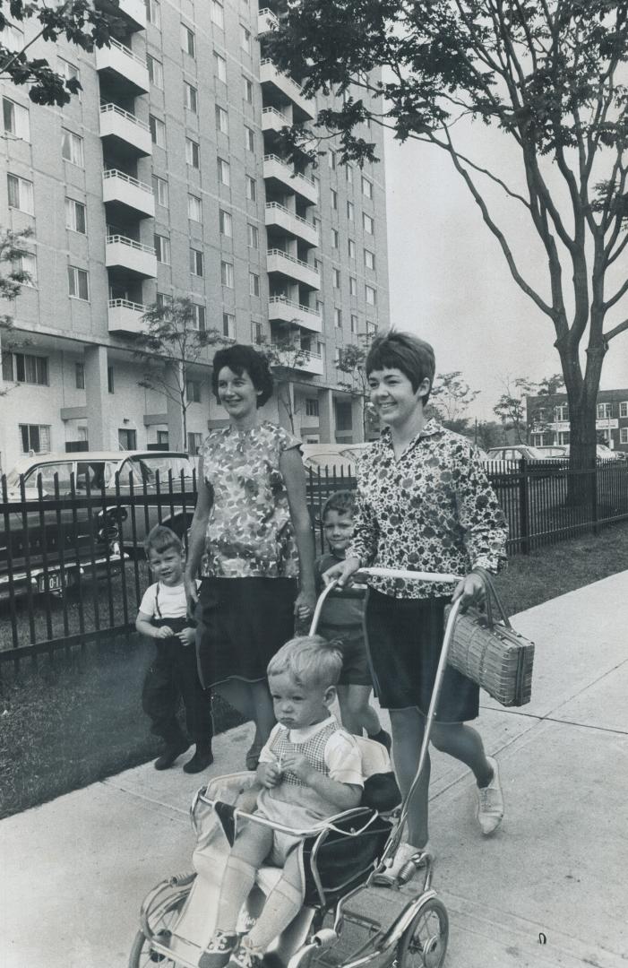 Mrs. Gerald soars, left, Mrs. Bryan Bonthron make sure their youngsters enjoy sun. Mrs. Soars lives in one of development's maisonettes. Bonthrons hav(...)