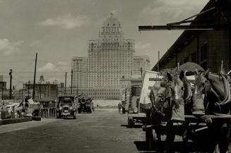 Commerce and magnificence are interestingly combined in this view of the Royal York hotel, Toronto