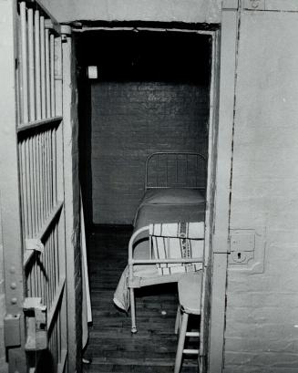 Windowless cubicle in the basement of Mercer is a detention cell