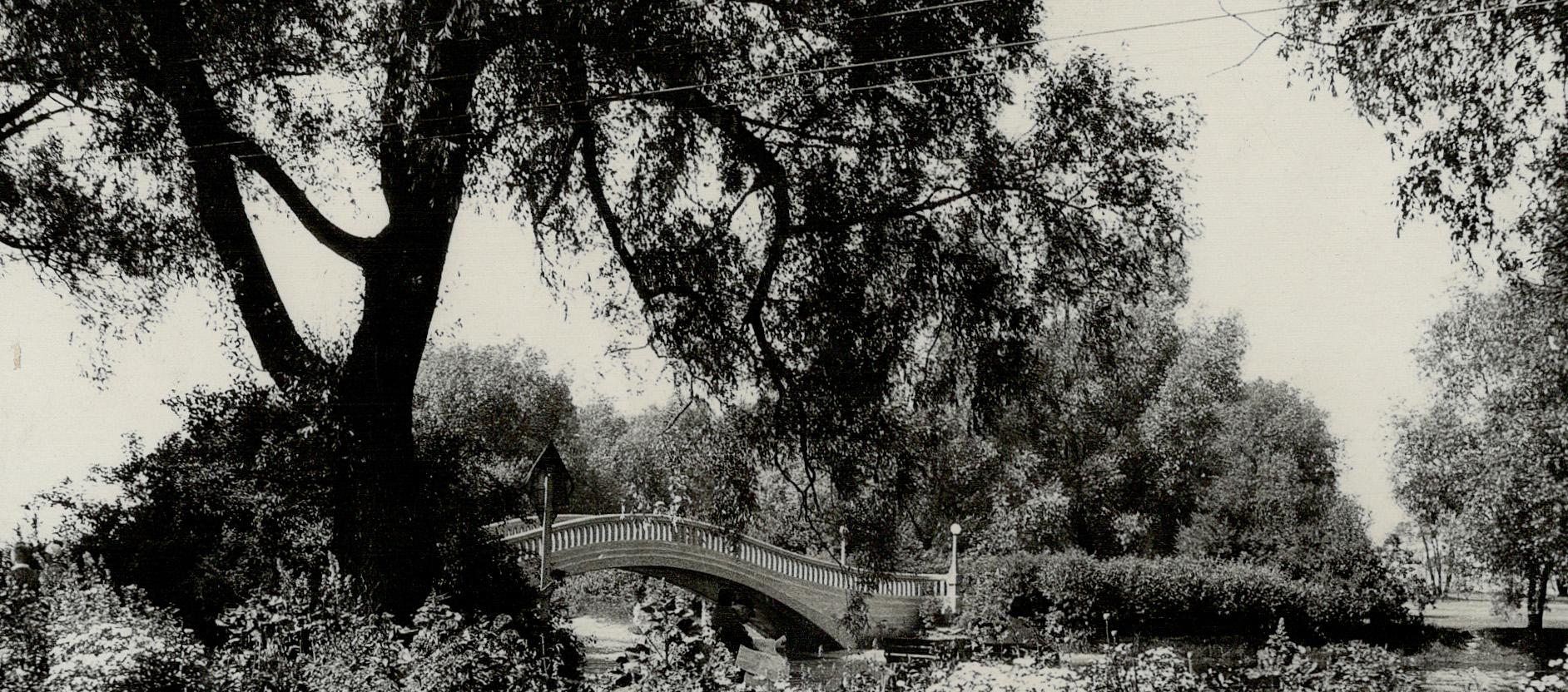 A pleasant scene on Centre Island, Toronto, showing the beautiful Olympia bridge that spans the lagoon