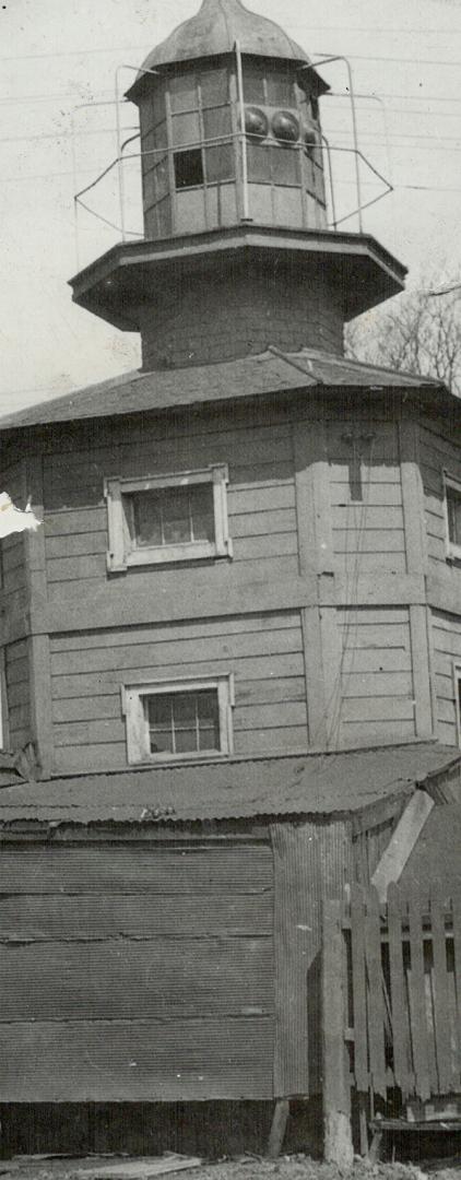 This old light house which once was the guide to the western entrance of Toronto harbor is now away back inland, with Fleet street separating it from the water