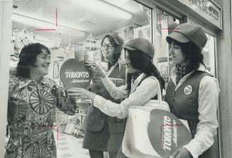 Toronto's big heart is placed on the window of Arcade Gift Baskets in the Yonge St