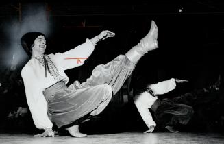 A dancer hits his stride in a Ukrainian prysidky at the Kyiv Pavilion on College St