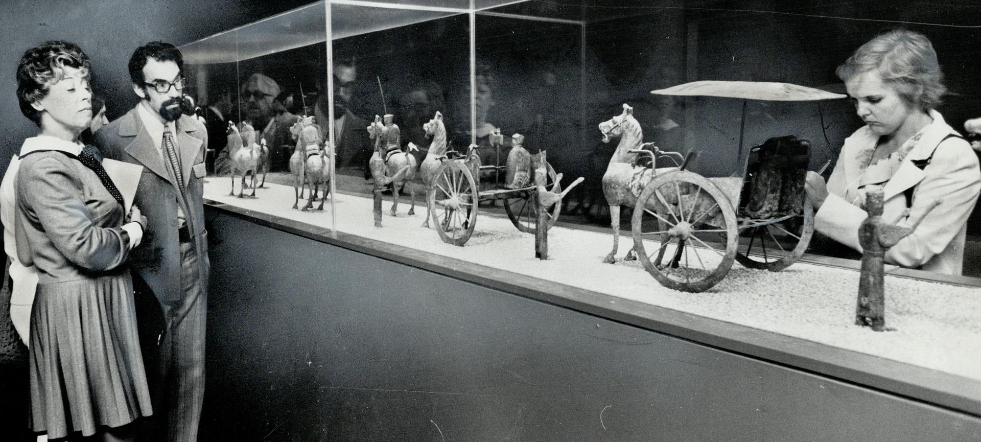 Viewers admire a display in the Chinese are exhibiton at the Royal Ontario Museum