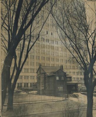 With progress rising up behind it in the shape of the new Imperial Oil building, this red brick house of Mrs