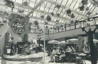 Lunch-hour oasis: Diners enjoy the sunny setting of the market court at Village by the Grange across from Art Gallery of Ontario