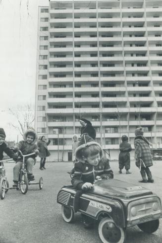 High rise apartments loom over nursery play area in Toronto just as they do in European centres