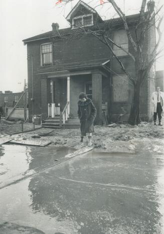 Mudholes form a moat around her Don Mount home, so Mrs