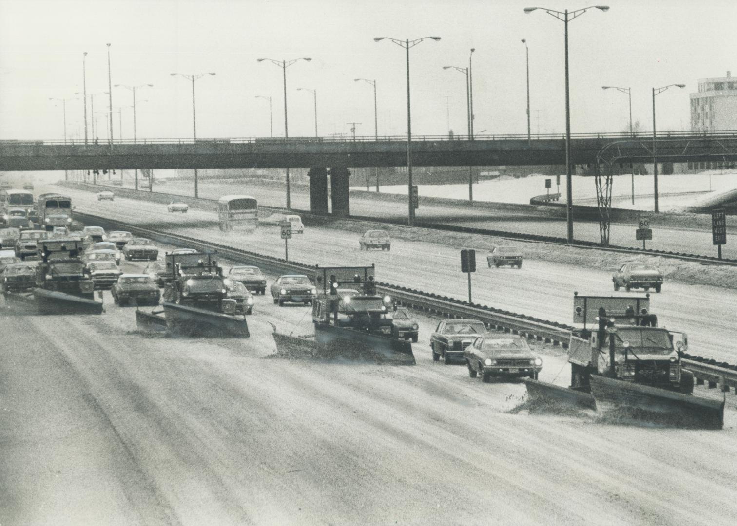 Battling the ice storm that made driving difficult and caused widespread blackouts in metro, four snowplows work their way south yesterday on Highway (...)