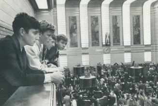 Getting a first-hand look at the Toronto Stock Exchange yesterday are four Grade 8 students from Scarborough's Fairmount public school: from left, Kar(...)