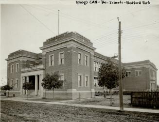 Original Toronto Star caption: Bedford park school. Image shows a two storey school with a few …