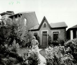 Lovely view: Homewood enjoys looking out her windows to the street and garden