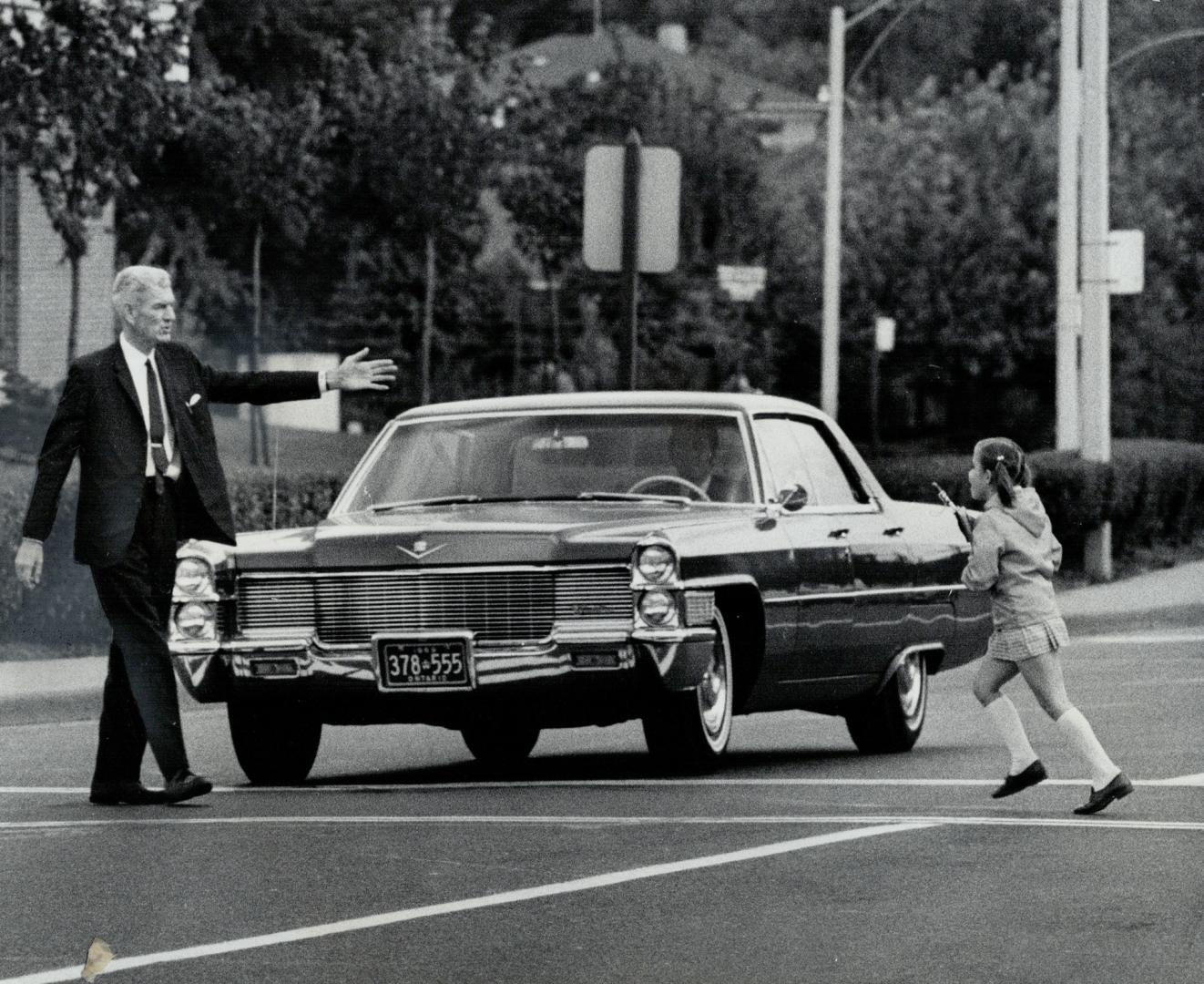 Principal Northcott stops car as pupil crosses street