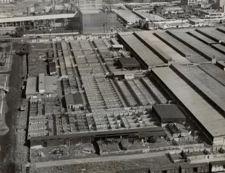 Empty stockyard pens at Toronto, seen in this air view, are harbingers of meatless menus to come if strike lasts