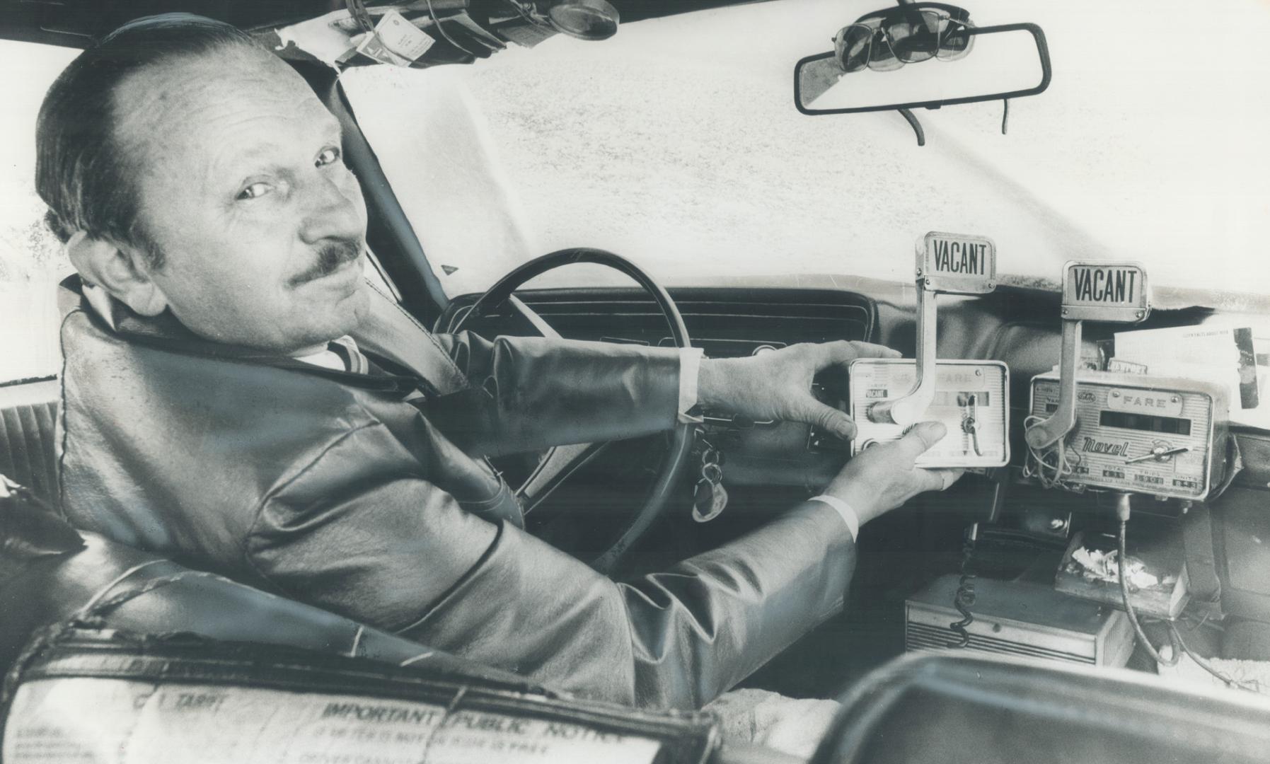 These two taxi meters look alike, but the one on the left, soon to be insatlled in a cab for Robert Sacks, will tick off dollars and cents in terms of(...)