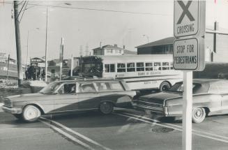 Cars pass school bus stopped at Finch Ave