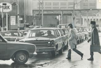 A system of one-way north and southbound traffic arteries is needed to combat traffic jams such as this one at Yonge and Wellington Sts. (above), says(...)