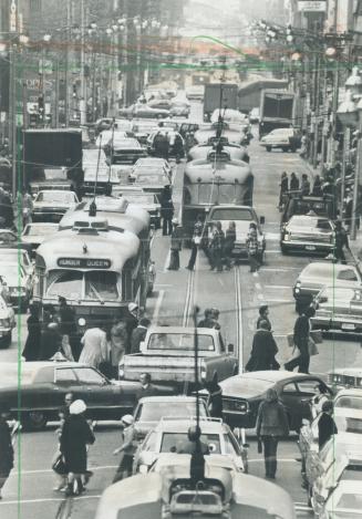 Bumper-to-bumper traffic clogs Queen St