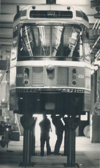 Keep 'em rolling: When streetcars need a checkup, a good scrubbing or a boost on the huge new hoist, they are wheeled into the Russsell Carhouse, one of the TTC's four streetcar barns