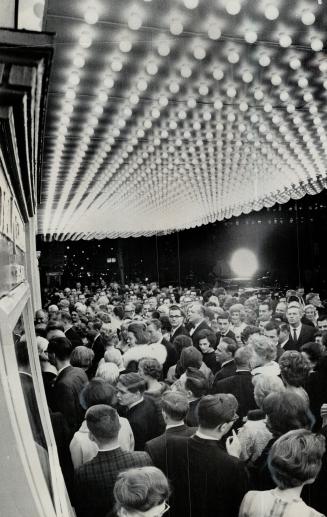 Crush of theatre goers get ready for a show a the Royal Alexandra Theatre