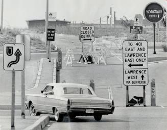 Signs of the times. Not so lucky is the chap below. This forest of signs at the intersection of Spadina Expressway and Highway 401 is more than enough to confuse Confucius