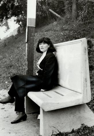 Cool seat? Judy Beaulieu is sitting on one of the new concrete benches Alderman Moscoe says could cause frost bite