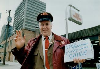 Smile stifled: David Middleton shows one of the signs he used to display at his ticket booth in the Sheppard station before the TTC told him to take them down