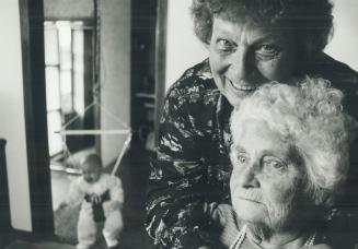 Busy Day: Ann Easveid, with grandchild at left, looks after mother, Anne Burgess, B2, who has Alzheimer's